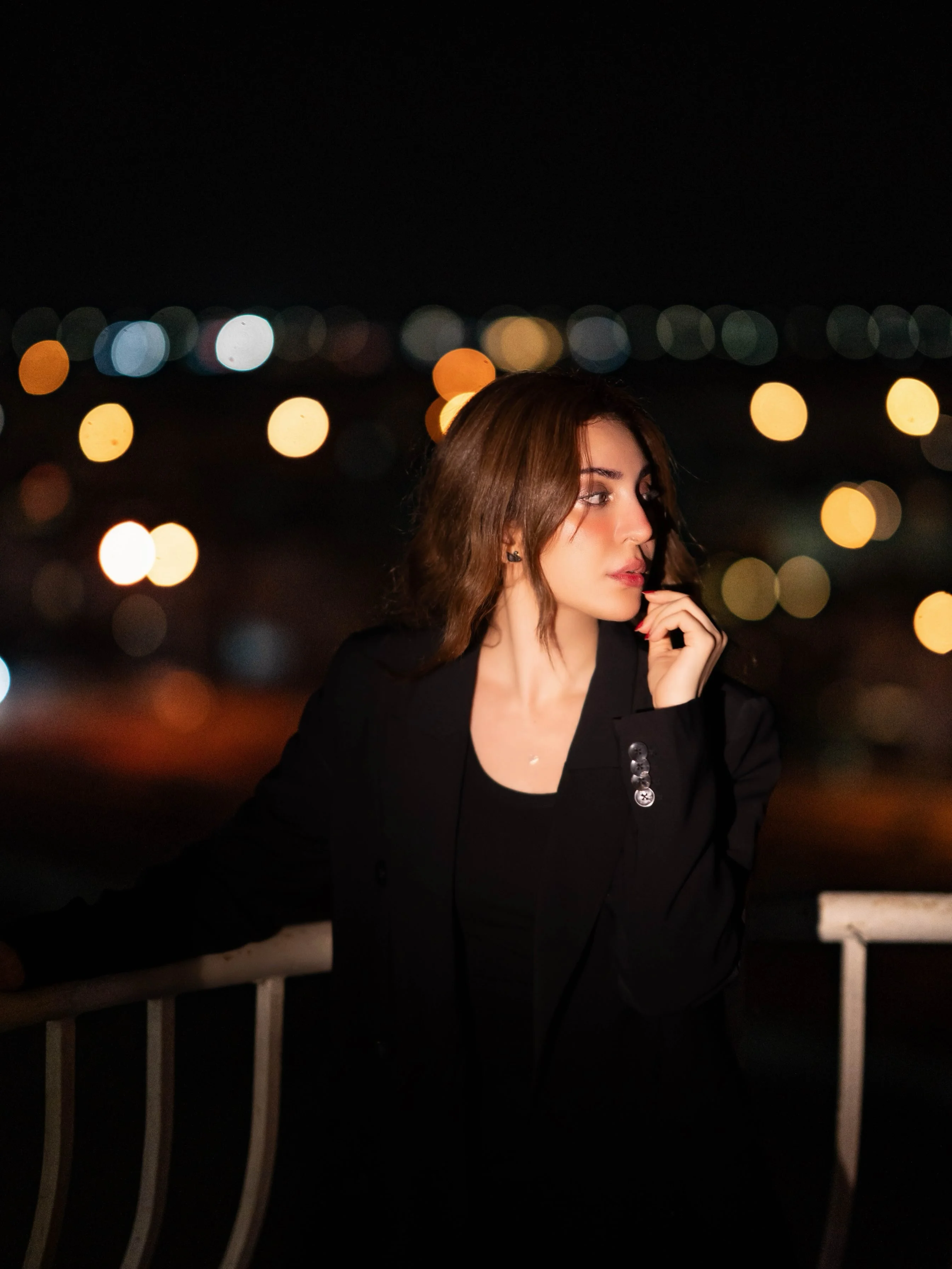 Professional portrait of Neha Khan in a black blazer, photographed by Umar Saleem